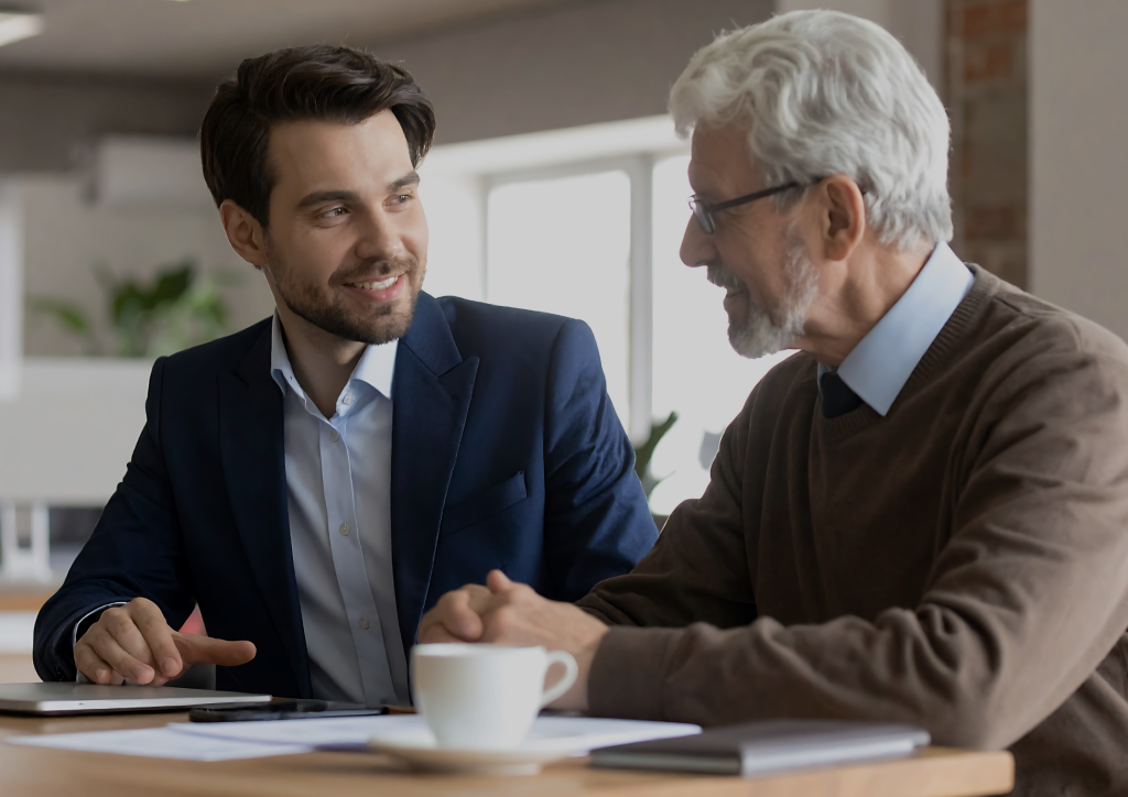 A professional real estate consultation taking place in a bright, modern high-end home office.