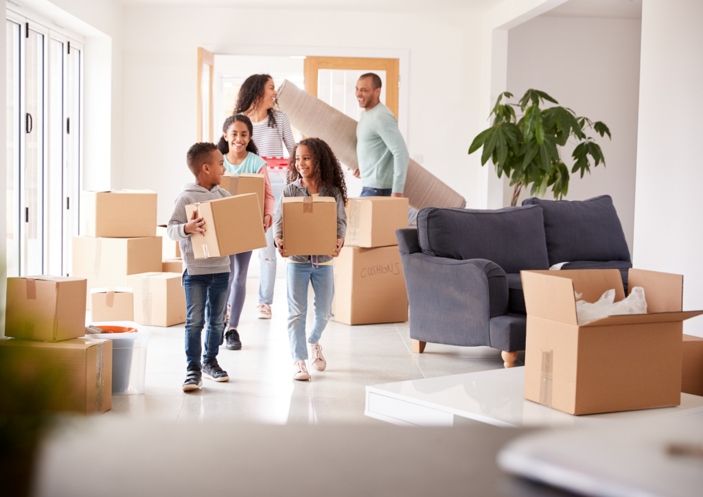 A row of upscale, traditional two-story luxury homes along a quiet, tree-lined suburban street at golden hour, representing high-demand Bay Area real estate.