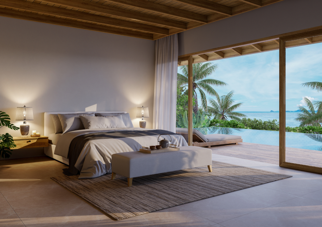 A stunning modern luxury living room with floor-to-ceiling windows overlooking a sunset view, demonstrating high-end real estate photography.